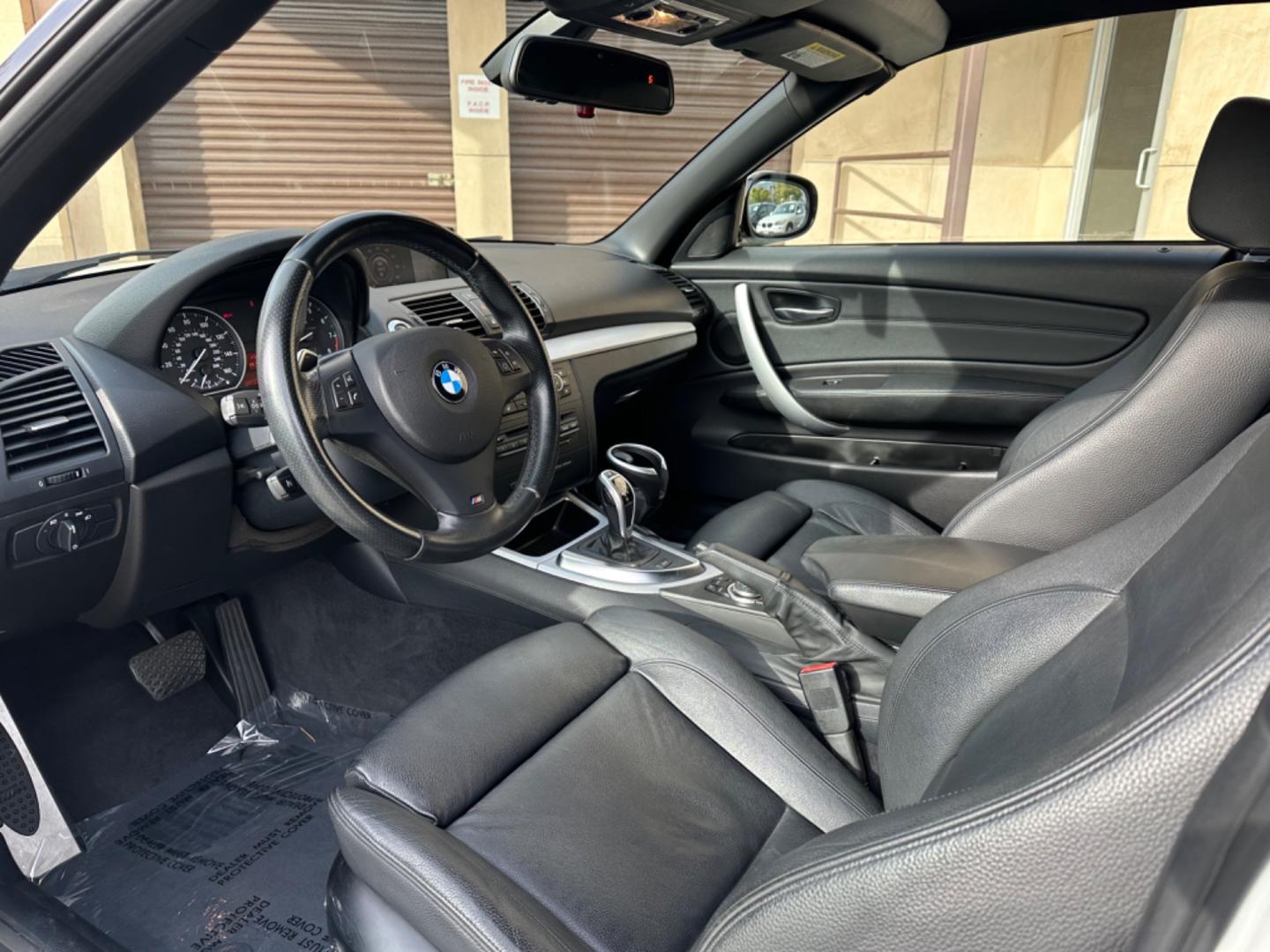 2011 WHITE /Black BMW 1-Series 135i Convertible (WBAUN7C56BV) with an 3.0L L6 DOHC 24V engine, Automatic transmission, located at 30 S. Berkeley Avenue, Pasadena, CA, 91107, (626) 248-7567, 34.145447, -118.109398 - Experience the Ultimate Driving Pleasure: 2011 BMW 135i Convertible Now Available in Pasadena, CA Discover the thrill of open-air driving with the 2011 BMW 135i Convertible, a perfect blend of luxury and performance, now featured at our BHPH dealership in Pasadena, CA. This exquisite convertible - Photo#9